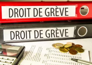 Classeurs mentionnant le droit de grève et illustrant les règles pour les travailleurs belges.